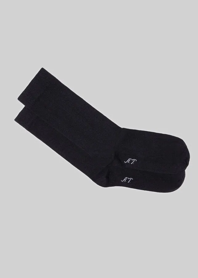 A charcoal-black crewneck sweatshirt laid flat against a light grey background.