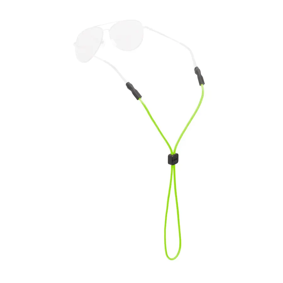 A bright green braided rope eyewear retainer with a square adjuster bead, clipped onto the temple tips of a pair of clear aviator-style glasses, shown against a white background.