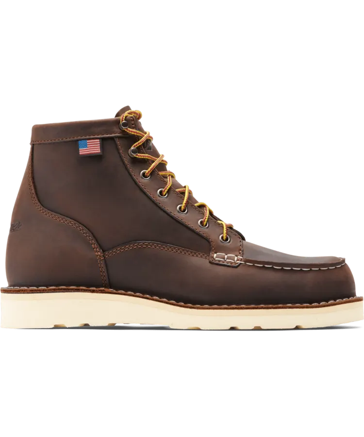 A brown leather moc-toe work boot with a natural crepe wedge sole and yellow-and-red laces, shown in profile against a white background.