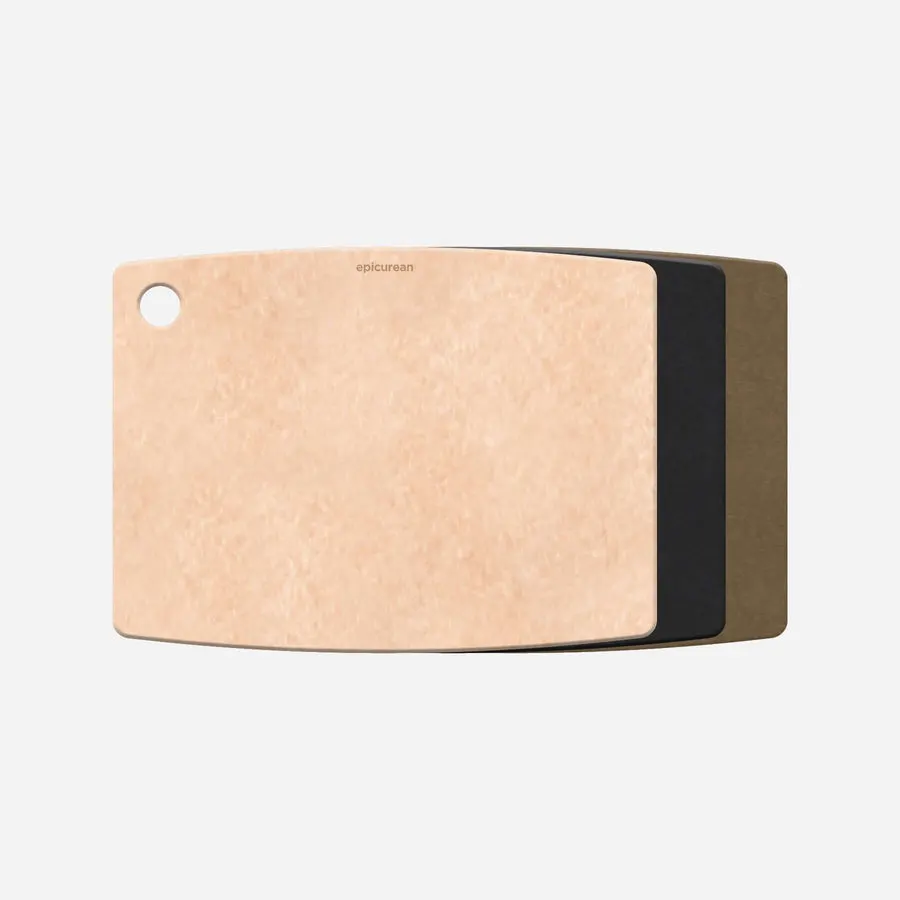 A natural-colored Epicurean cutting board with a rounded hang hole, shown edge-on stacked in front of a black and an olive-colored board of the same shape.