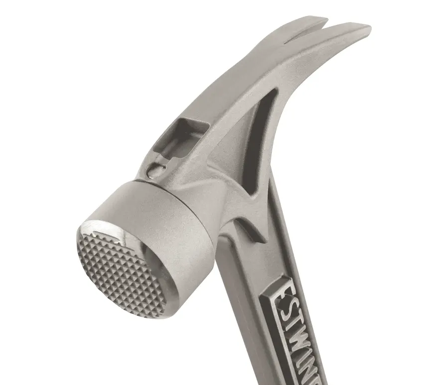 Close-up of a titanium hammer head and checkered strike face, angled against a white background, with the ESTWING name forged into the neck.