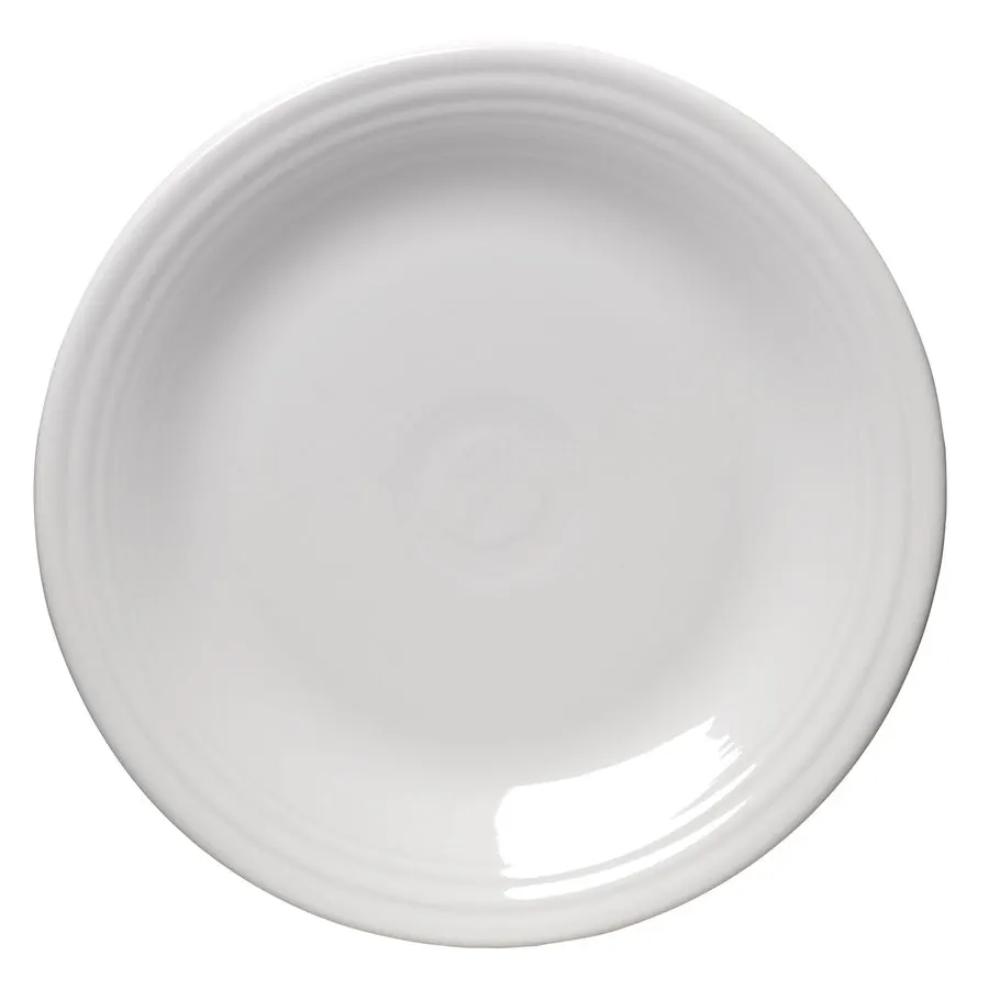 A single round white ceramic dinner plate with the classic Fiesta concentric-ring rim, shot from directly overhead on a white background.