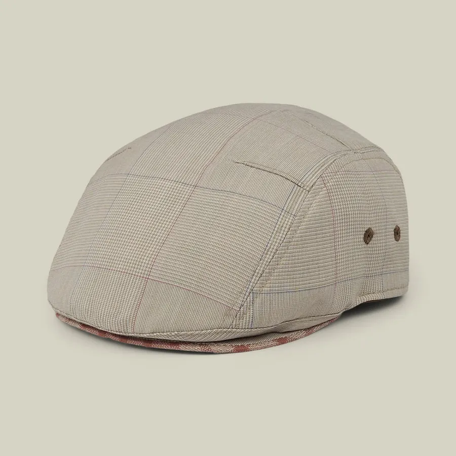 A tan micro-plaid 3-panel darted ivy cap with breathable eyelets, shown at a three-quarter angle against a plain background.