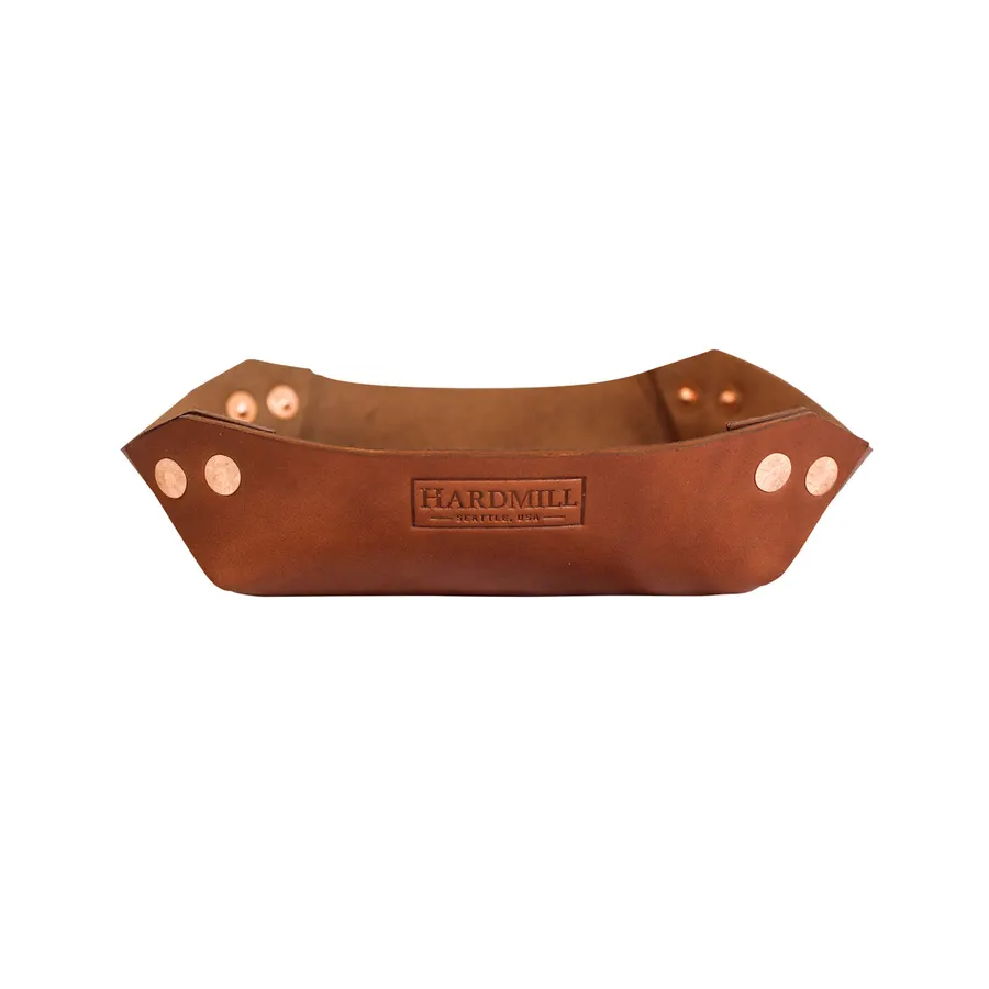 A rectangular brown leather valet tray with folded, riveted corners and a stamped Hardmill Seattle USA logo, shown against a white background.