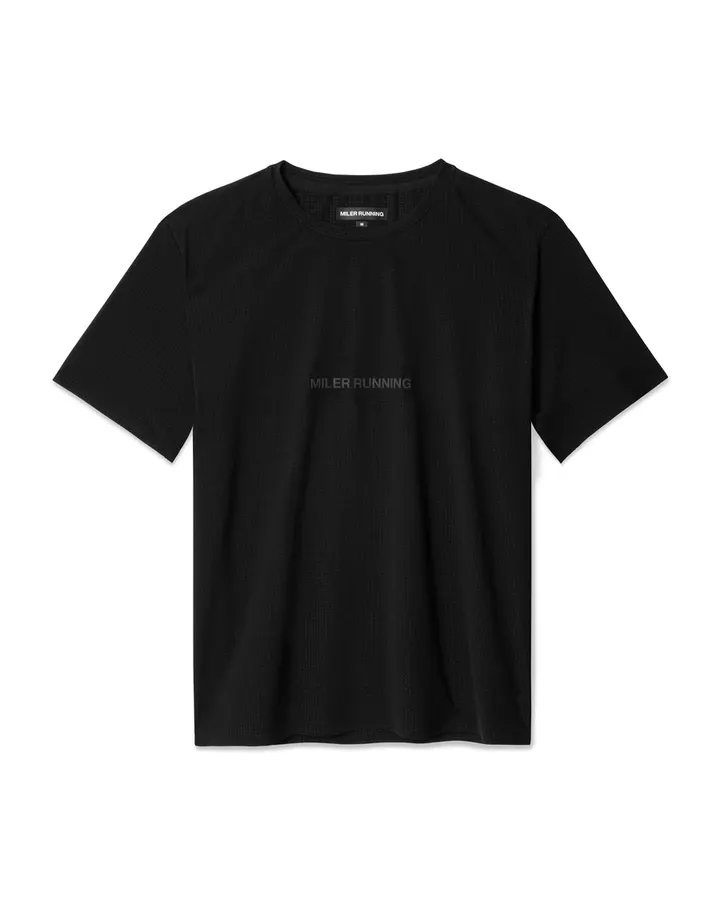 A black short-sleeve crewneck t-shirt with a small woven Miler Running neck label and faint tonal logo print on the chest, shown flat on a white background.