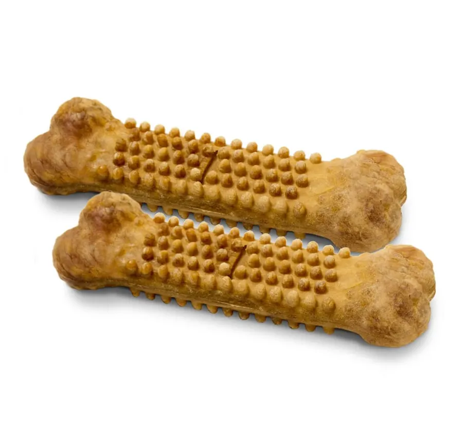 Two bone-shaped edible dog chew treats with a textured, knobby surface, lying side by side against a plain white background.