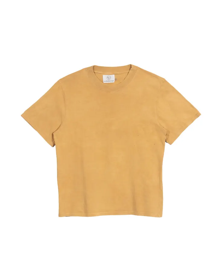 A mustard-gold short-sleeve crewneck t-shirt with a woven neck label, laid flat against a white background.