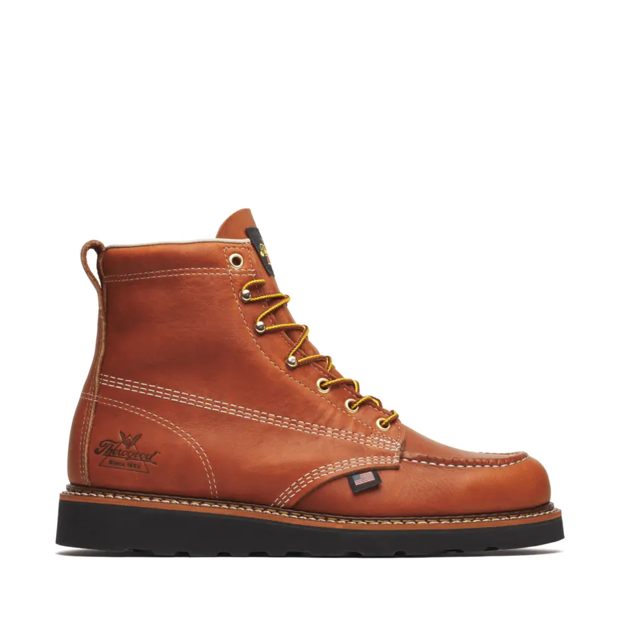 A single tan leather moc-toe work boot with gold-and-black laces, a black heel pull tab, and a black wedge sole, photographed in side profile against a white background.