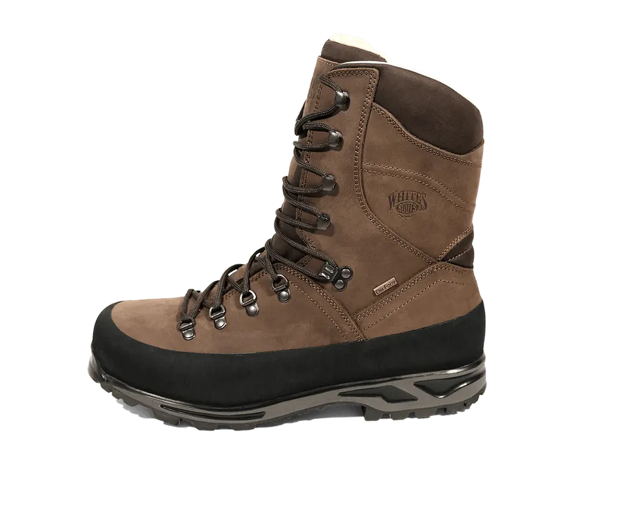 A tall brown nubuck hunting boot with a black rubber-wrapped toe and lug outsole, shown in profile against a white background.