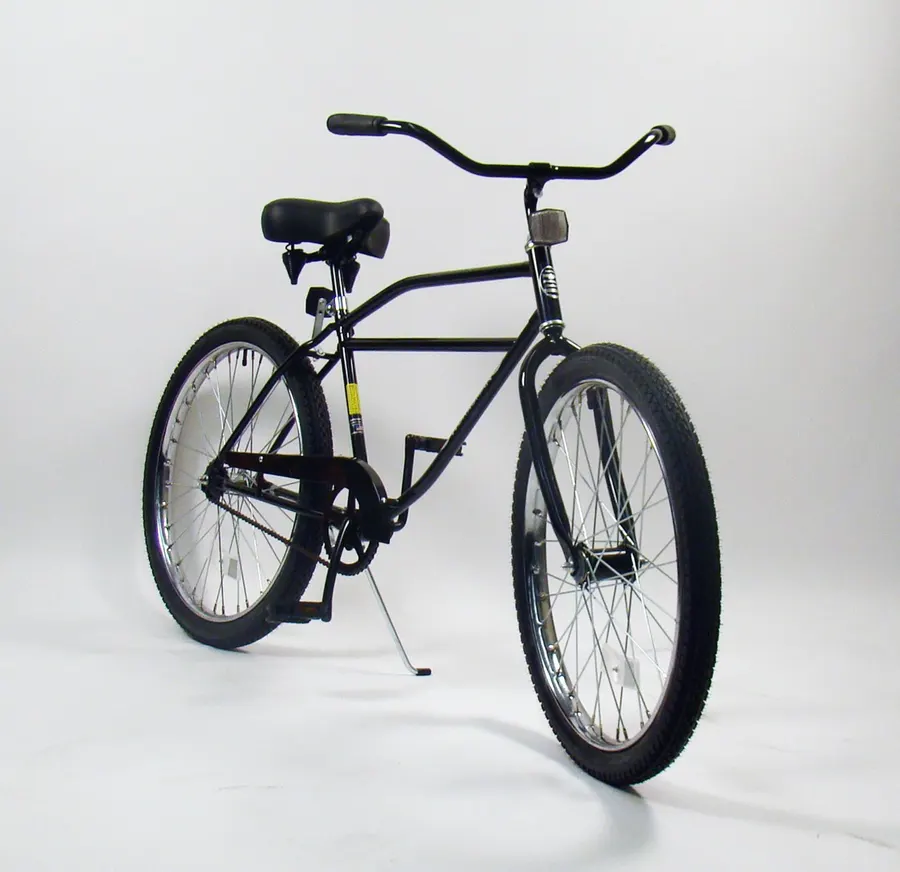 A black Worksman men's cruiser bicycle with a tan seat and grips, photographed at an angle on a plain white studio background.